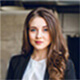 Alisha Martin headshot smiling, co-founder portrait with neutral background, conveys warm and positive tone